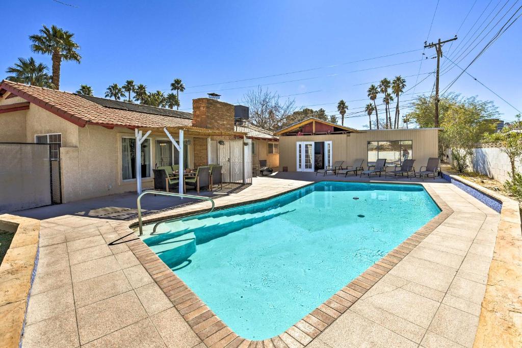 a swimming pool in the backyard of a house at Elegant Home with Pool Table 3 Miles to The Strip! in Las Vegas