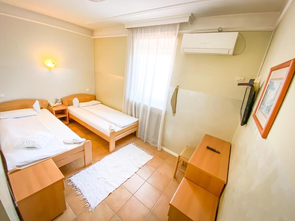Postel nebo postele na pokoji v ubytování Sobe Rimski