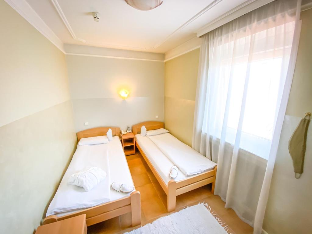 Postel nebo postele na pokoji v ubytování Sobe Rimski