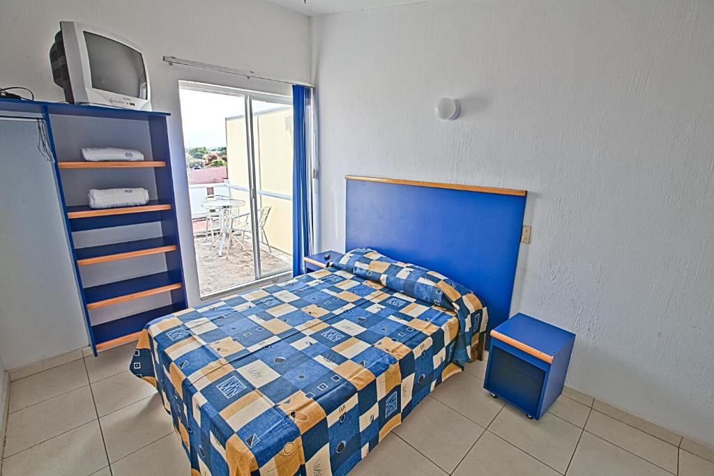 Postel nebo postele na pokoji v ubytování Hotel H Americas