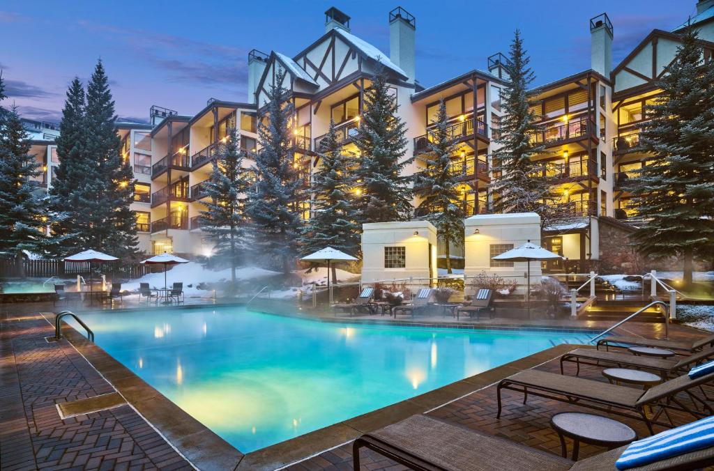 a large swimming pool in front of a hotel at Montaneros in Vail in Vail
