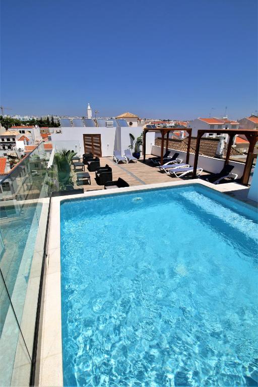 Bazén v ubytování Authentic Tavira Hotel nebo v jeho okolí