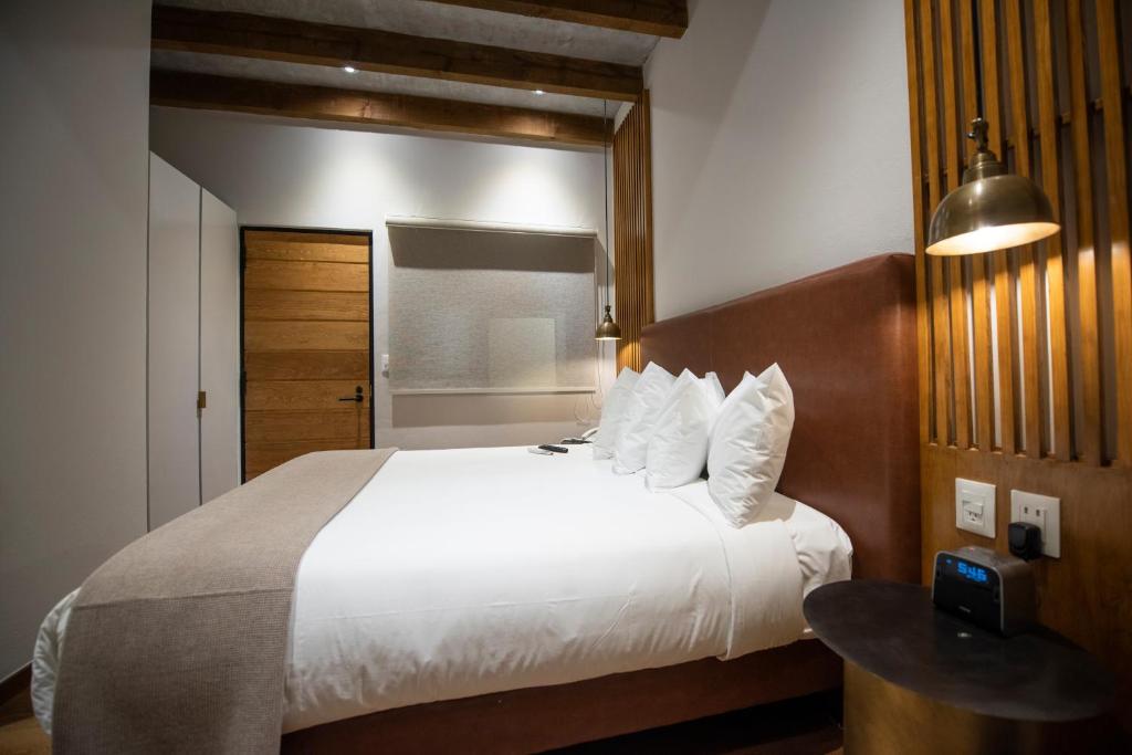 Postel nebo postele na pokoji v ubytování Hotel Madi