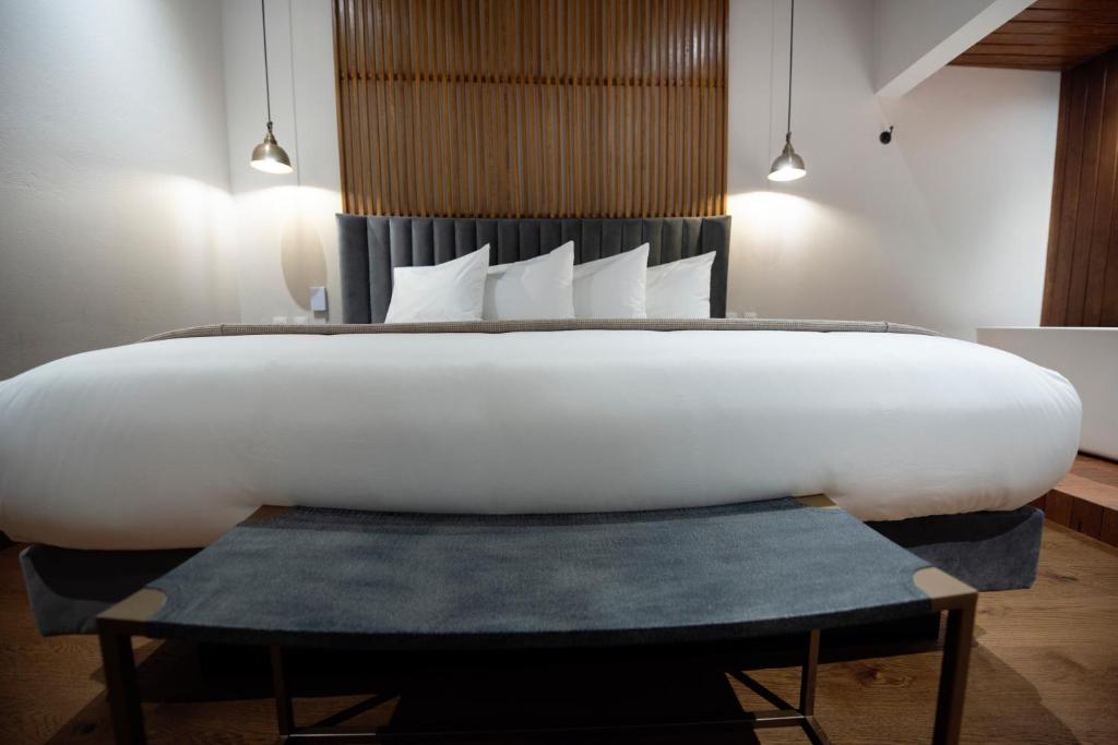 Postel nebo postele na pokoji v ubytování Hotel Madi