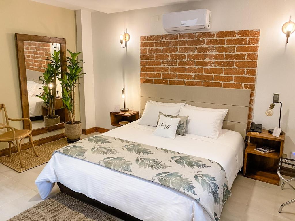 Postel nebo postele na pokoji v ubytování Casa Bixa Hotel Boutique - Mayores de 12 años -
