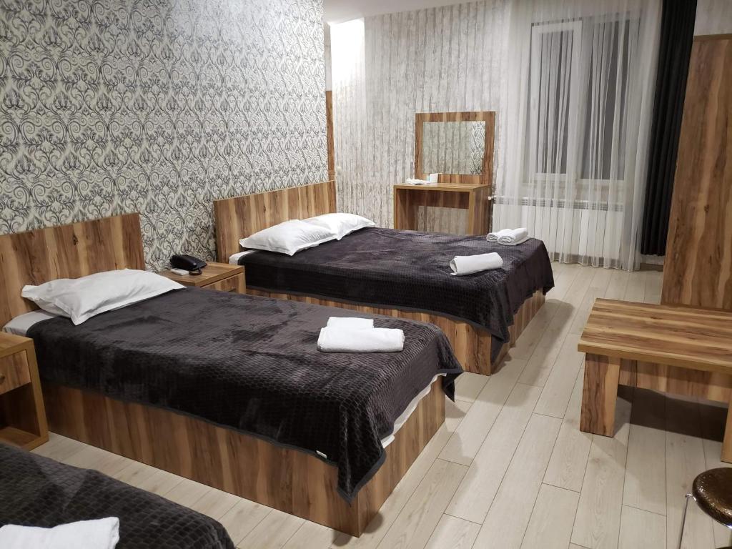 Postel nebo postele na pokoji v ubytování MikePalace