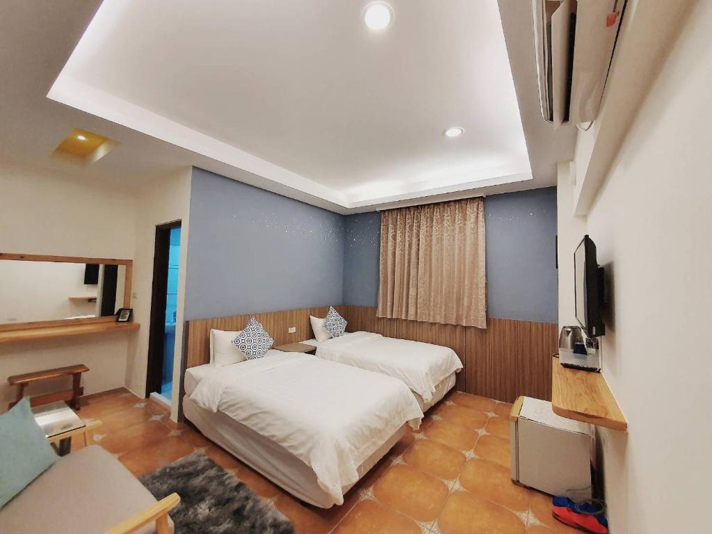 Katil atau katil-katil dalam bilik di Warm & Cozy Inn
