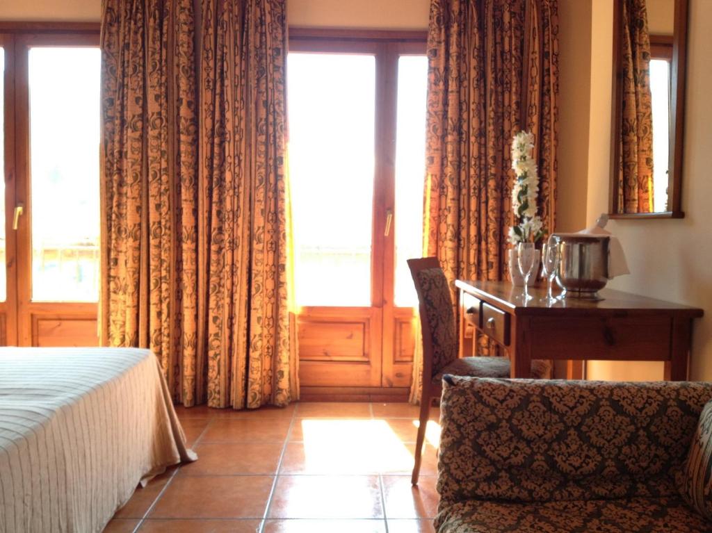 Postel nebo postele na pokoji v ubytování Hotel Xalet Verdú
