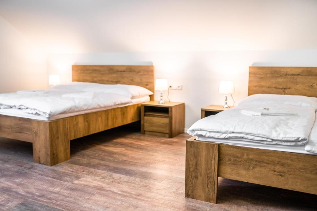 Postel nebo postele na pokoji v ubytování Penzion a Restaurace v Zátiší