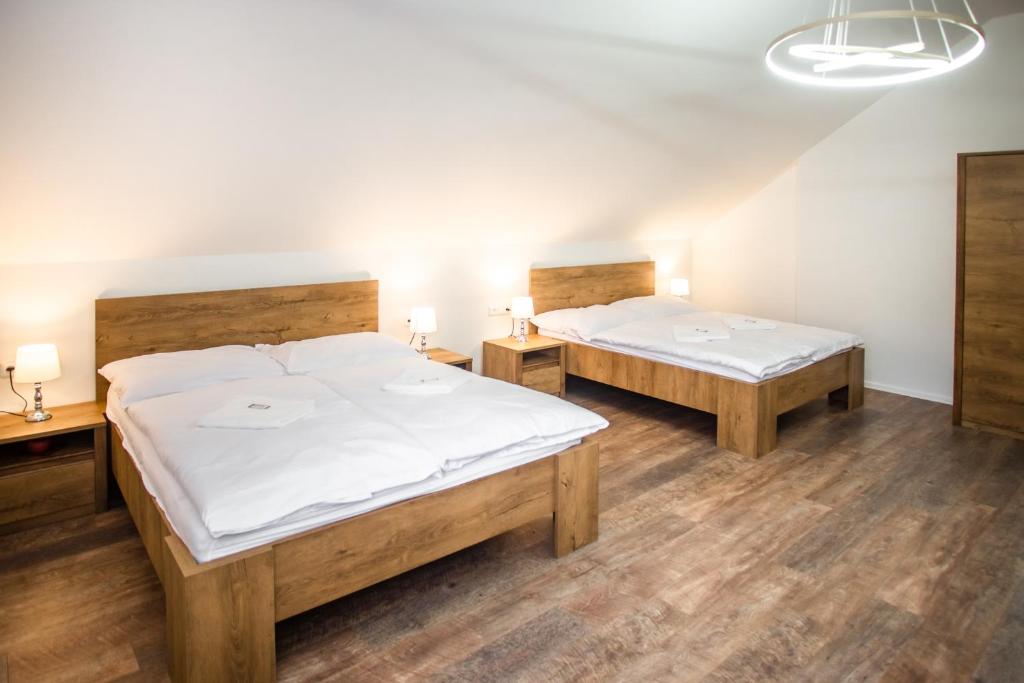 Postel nebo postele na pokoji v ubytování Penzion a Restaurace v Zátiší