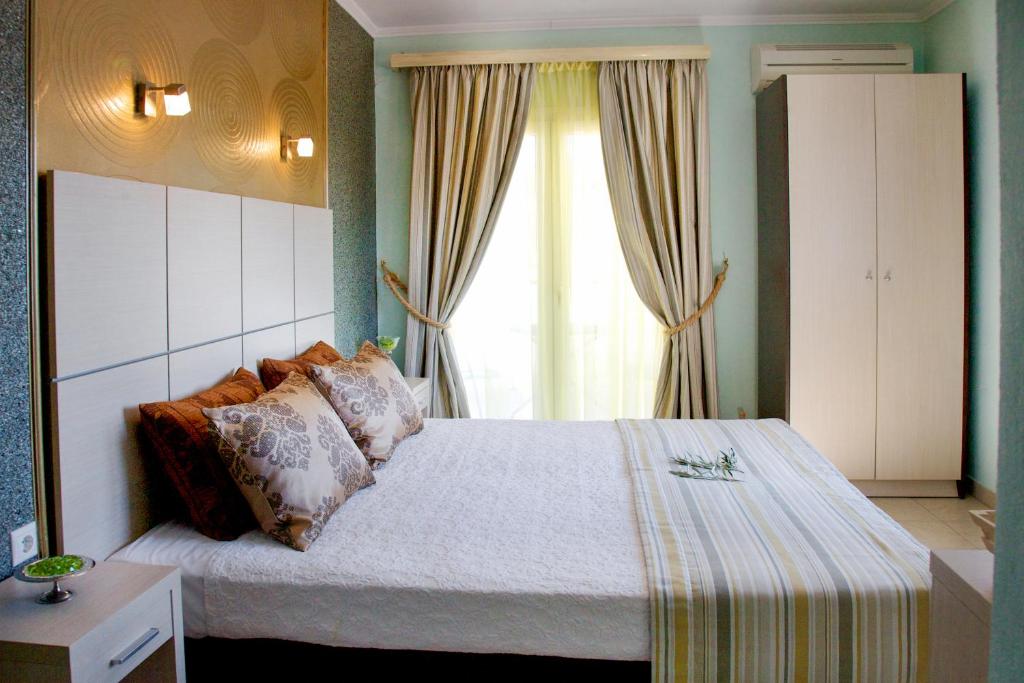 Postel nebo postele na pokoji v ubytování Kaplanis House