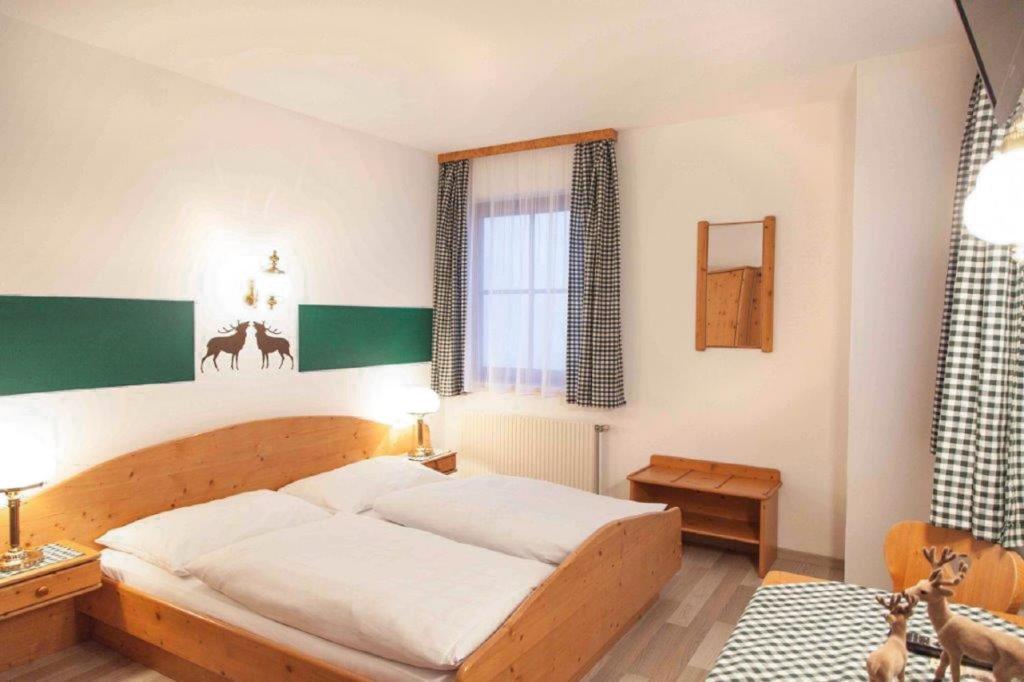 Postel nebo postele na pokoji v ubytování Gasthof Schindler