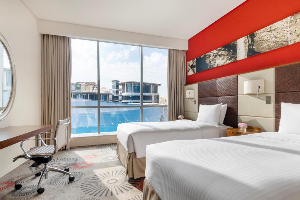 Postel nebo postele na pokoji v ubytování Crowne Plaza Doha - The Business Park by IHG