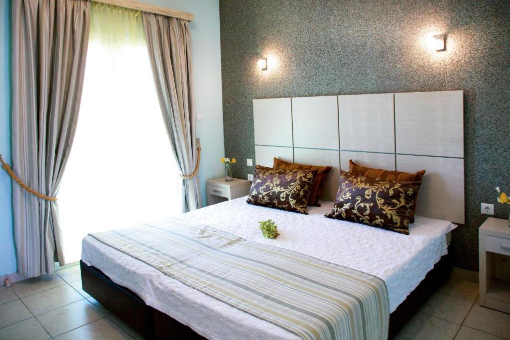 Postel nebo postele na pokoji v ubytování Kaplanis House