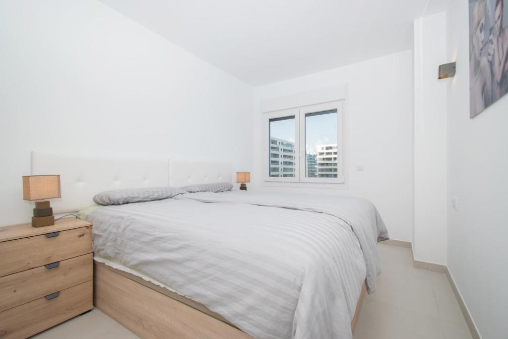 A bed or beds in a room at 213 Luxury Panorama - Alicante Holiday