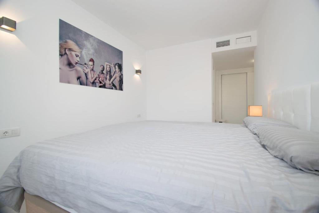 A bed or beds in a room at 213 Luxury Panorama - Alicante Holiday