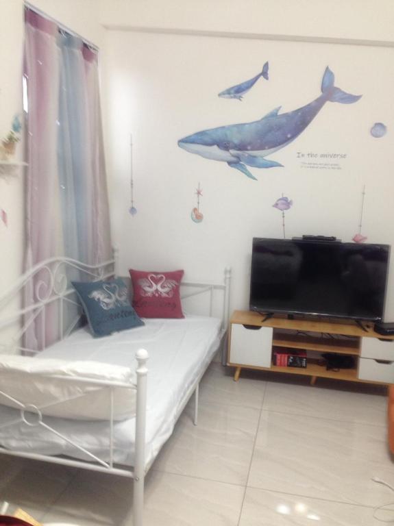 Een TV en/of entertainmentcenter bij 星動小屋民宿
