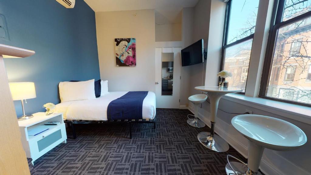 a hotel room with a bed and a window at South End Studio, Ideal for Boston Travelers #23 in Boston