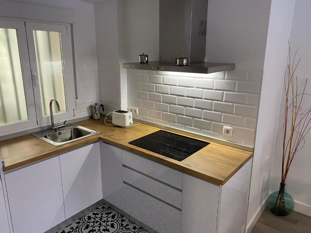 Kuchyň nebo kuchyňský kout v ubytování Apartamento Dacosta
