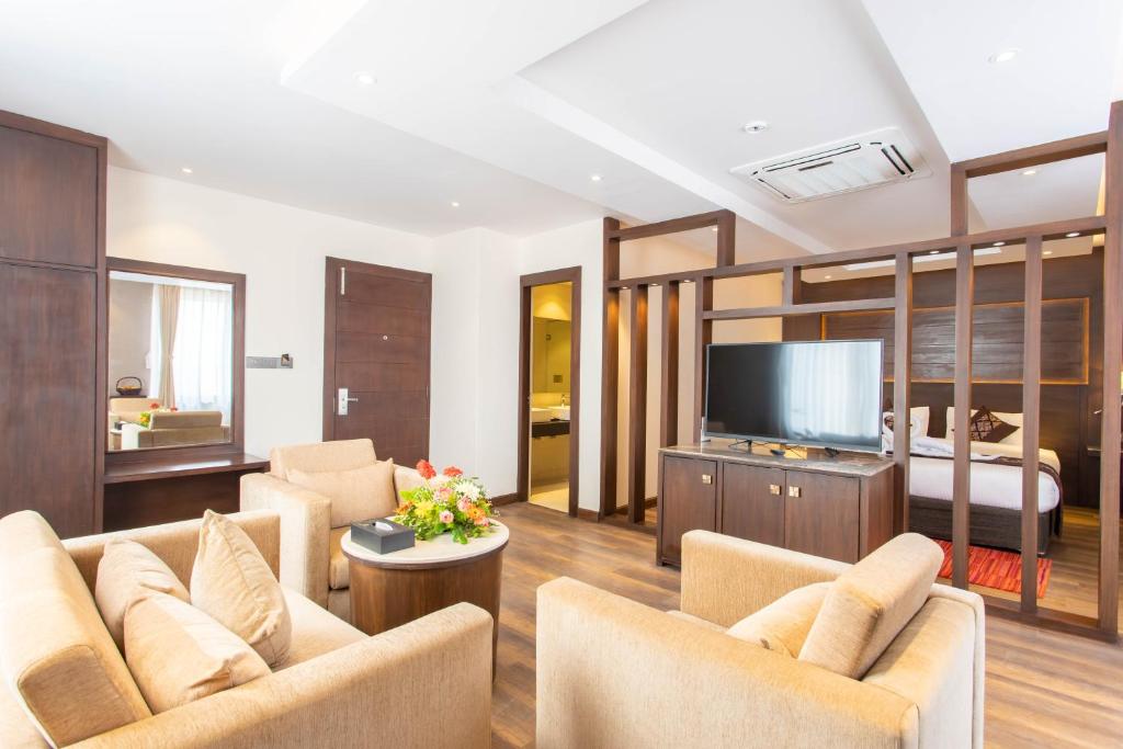 TV a/nebo společenská místnost v ubytování Hotel Da Flamingo