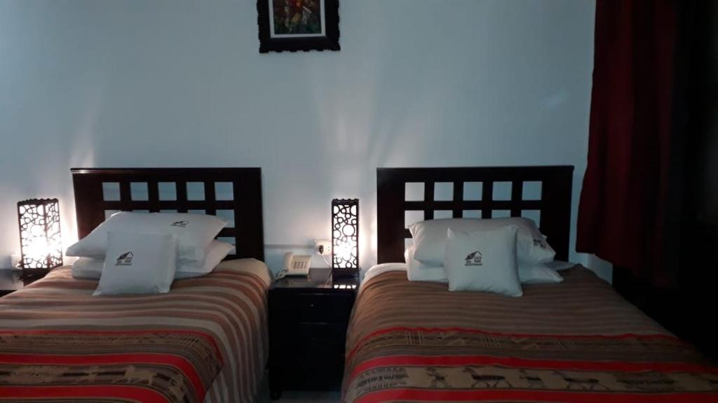 Letto o letti in una camera di Cusco Bed and Breakfast