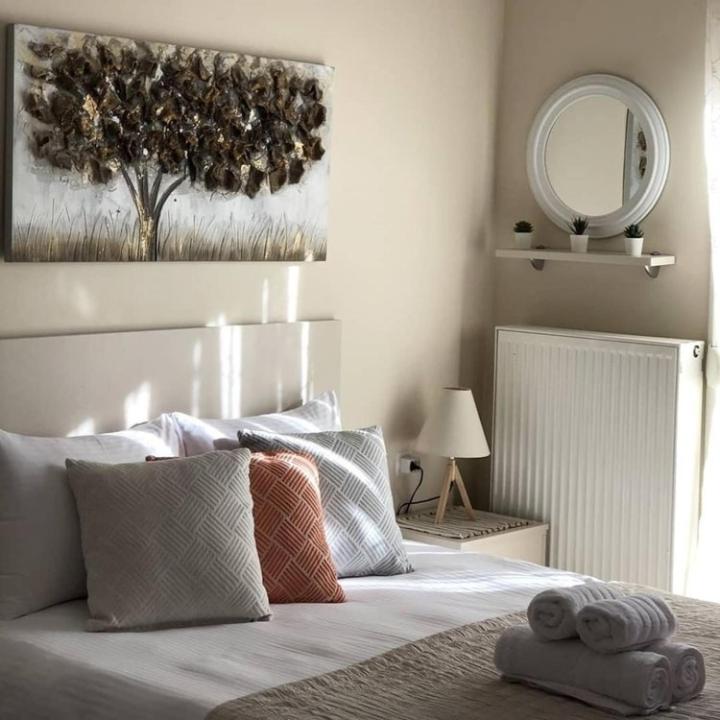 Кровать или кровати в номере Stergios_Apartments 06