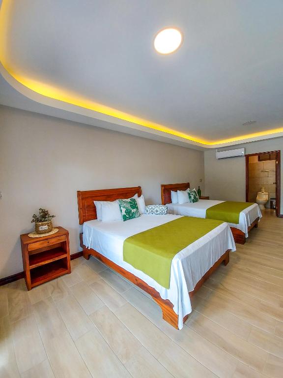 Postel nebo postele na pokoji v ubytování Hotel Amira
