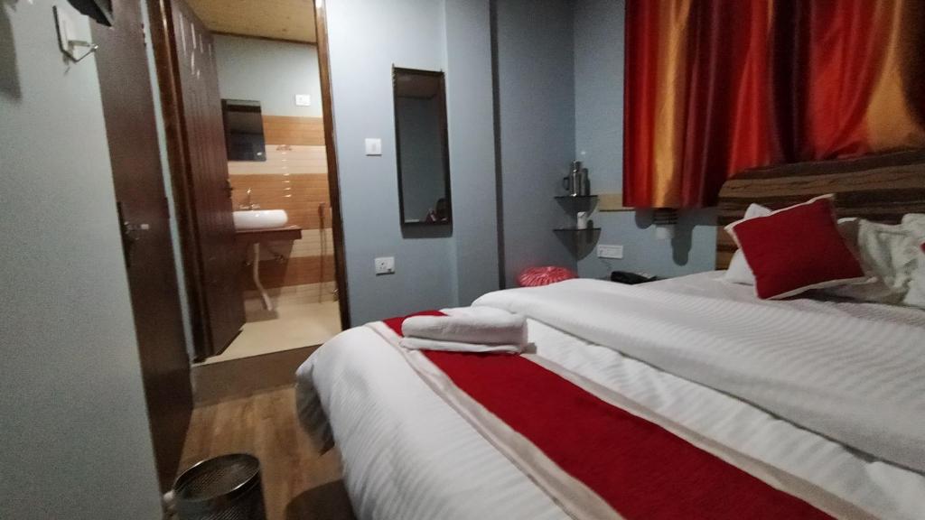Postel nebo postele na pokoji v ubytování SVR INN