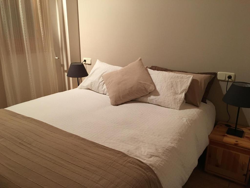 Postel nebo postele na pokoji v ubytování Apartaments Cal Borda