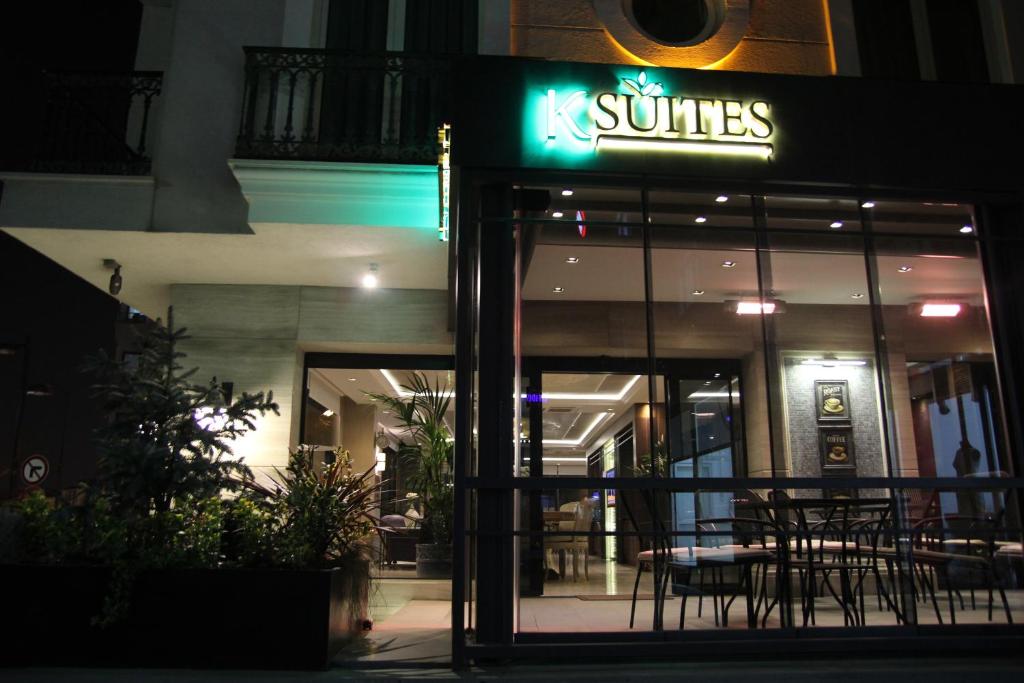 a restaurant with a sign on the front of it at night at Şişli Luxury K Suites Hotel in Istanbul