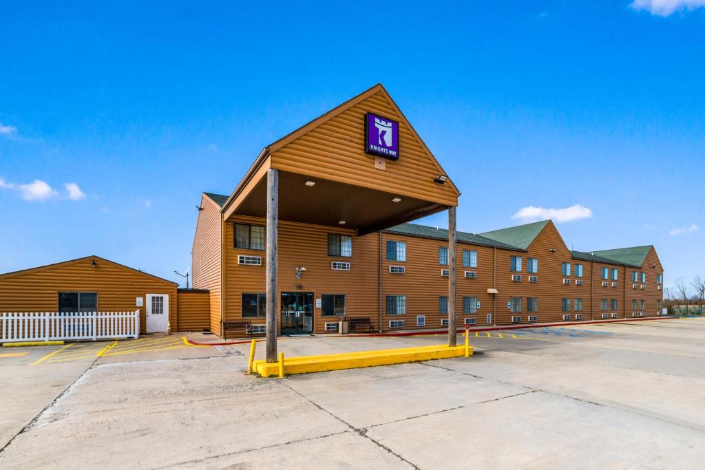 a large building with a sign on top of it at Knights Inn New Florence in New Florence