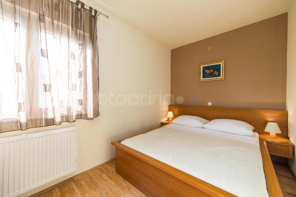 Posteľ alebo postele v izbe v ubytovaní City Central Apartments Dolore
