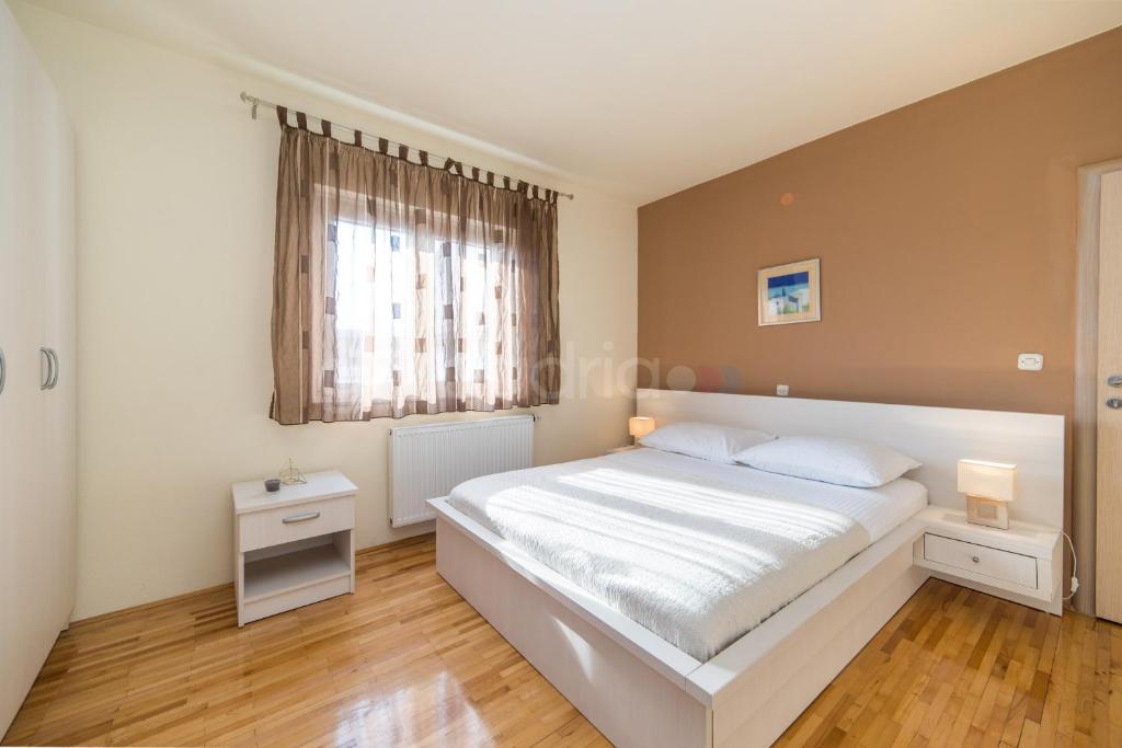 Posteľ alebo postele v izbe v ubytovaní City Central Apartments Dolore
