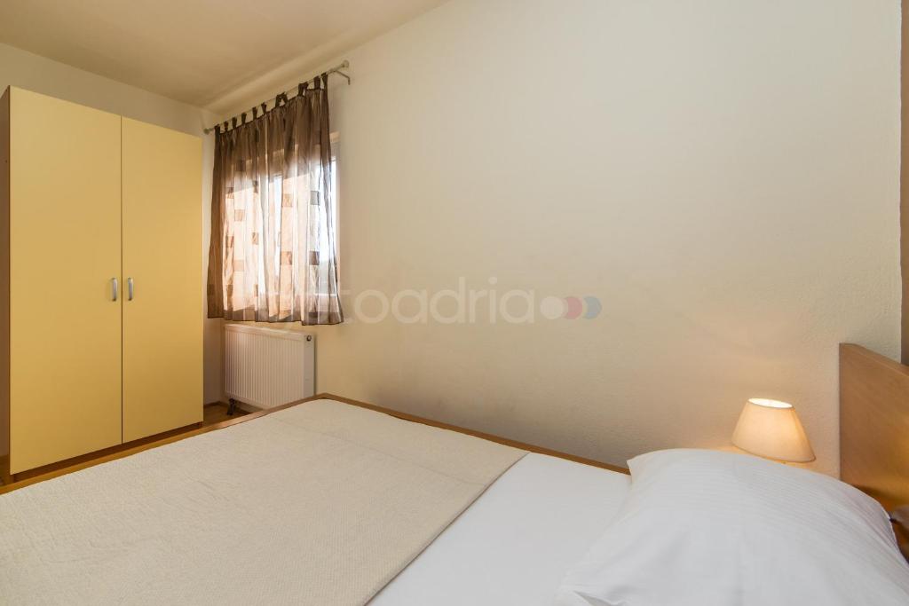 Posteľ alebo postele v izbe v ubytovaní City Central Apartments Dolore
