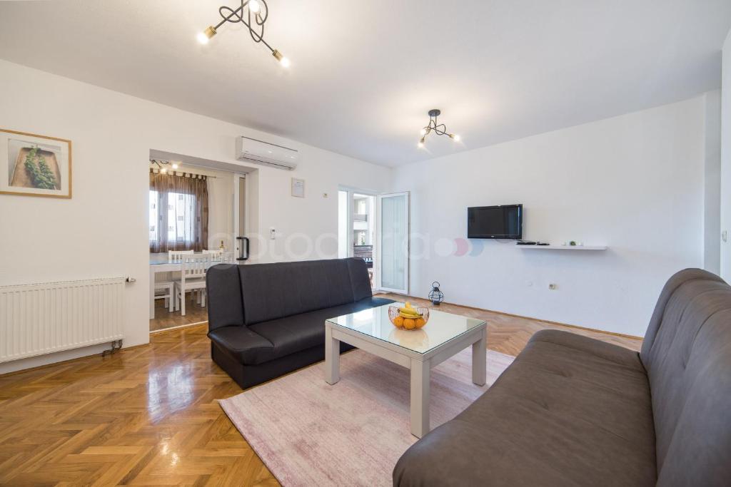 Televízia a/alebo spoločenská miestnosť v ubytovaní City Central Apartments Dolore