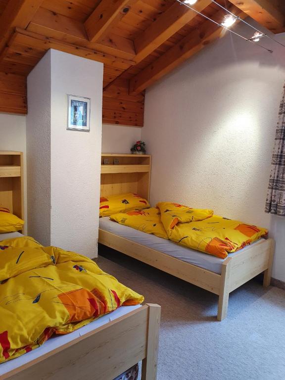 Postel nebo postele na pokoji v ubytování Chalet Alba A