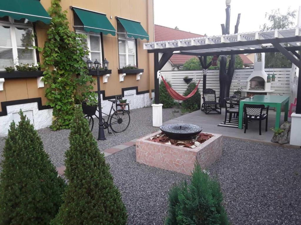 a courtyard of a house with a fire pit at Mysig takvåning med balkong in Eskilstuna