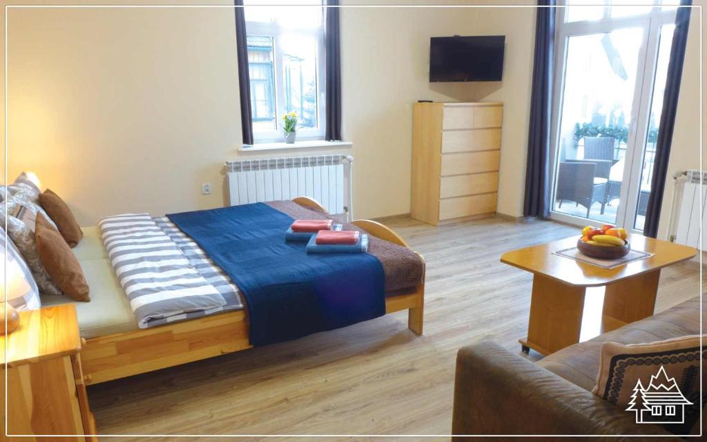 Posteľ alebo postele v izbe v ubytovaní Przystanek Rabka - Apartamenty w centrum