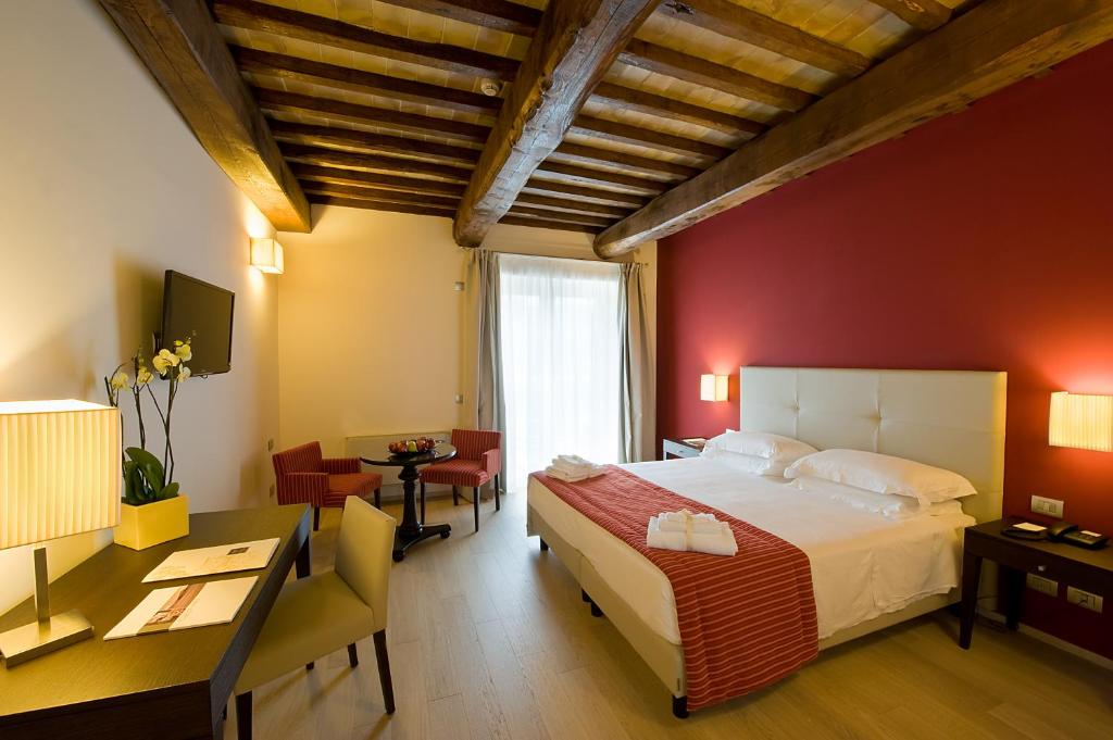 Postel nebo postele na pokoji v ubytování Relais dell'Olmo