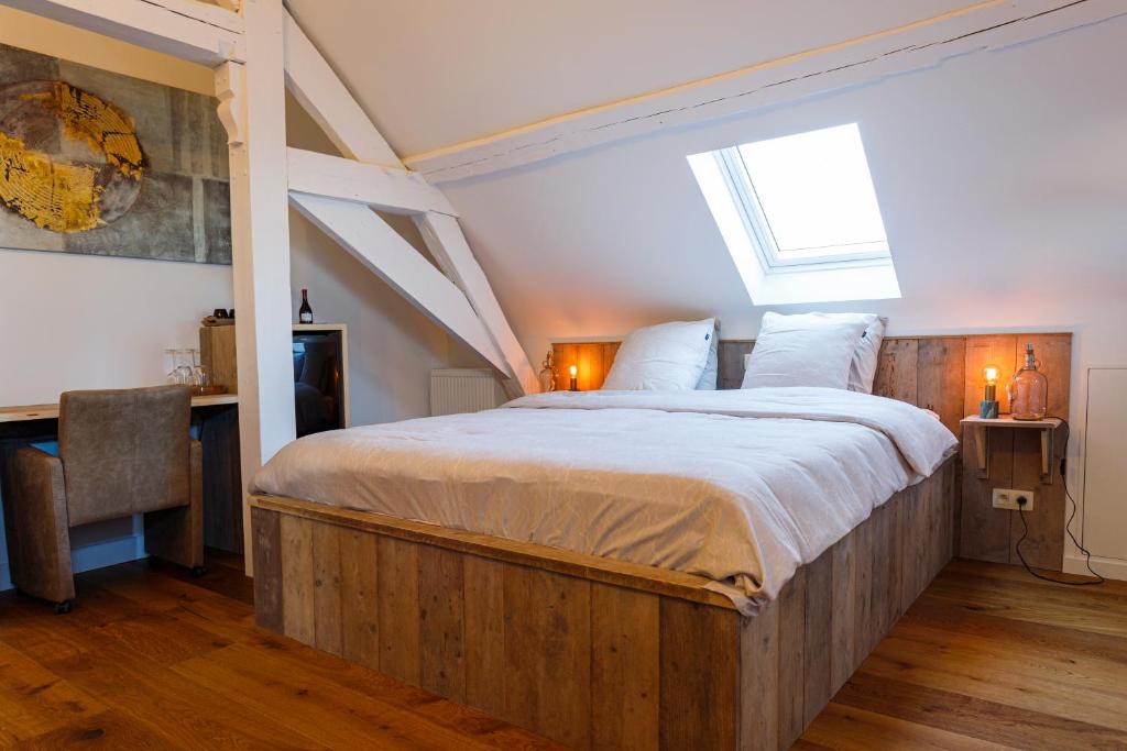 Postel nebo postele na pokoji v ubytování B&B 'T ZOUTE