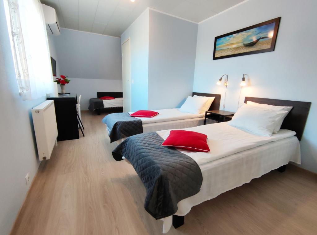 Postel nebo postele na pokoji v ubytování Aisa Guesthouse