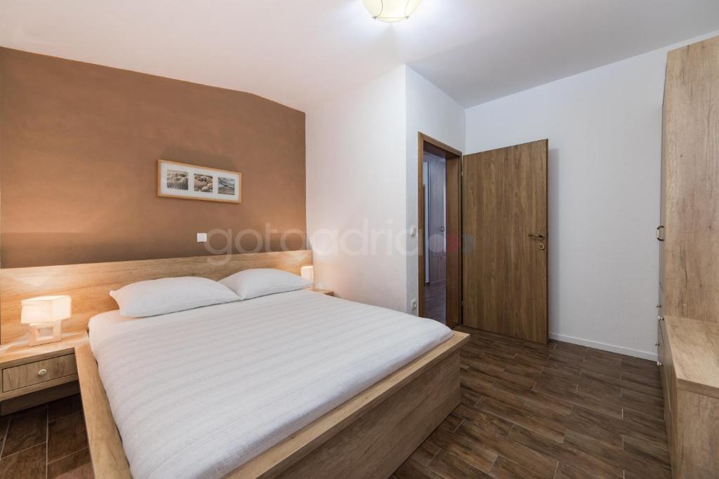 Posteľ alebo postele v izbe v ubytovaní City Central Apartments Dolore