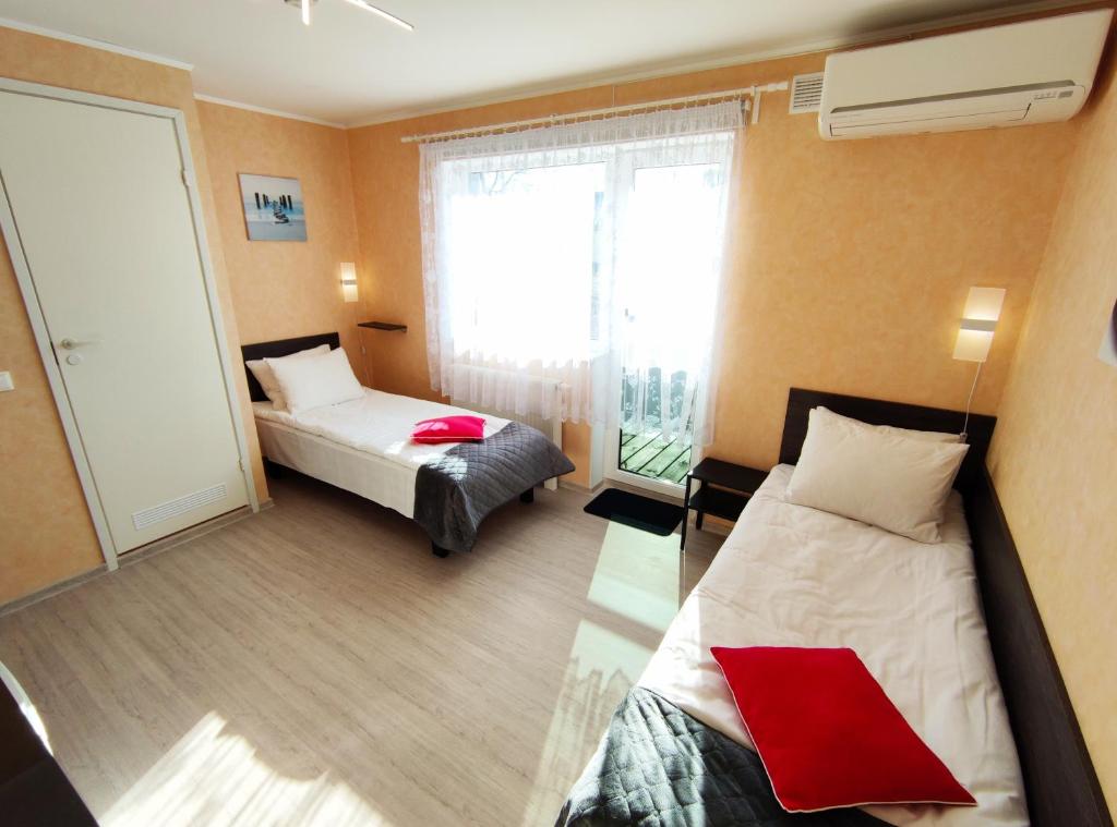 Postel nebo postele na pokoji v ubytování Aisa Guesthouse