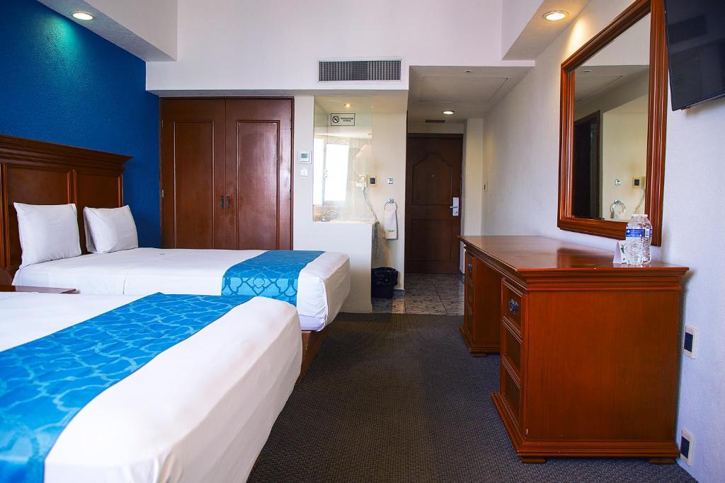 Postel nebo postele na pokoji v ubytování Hotel Lois Veracruz