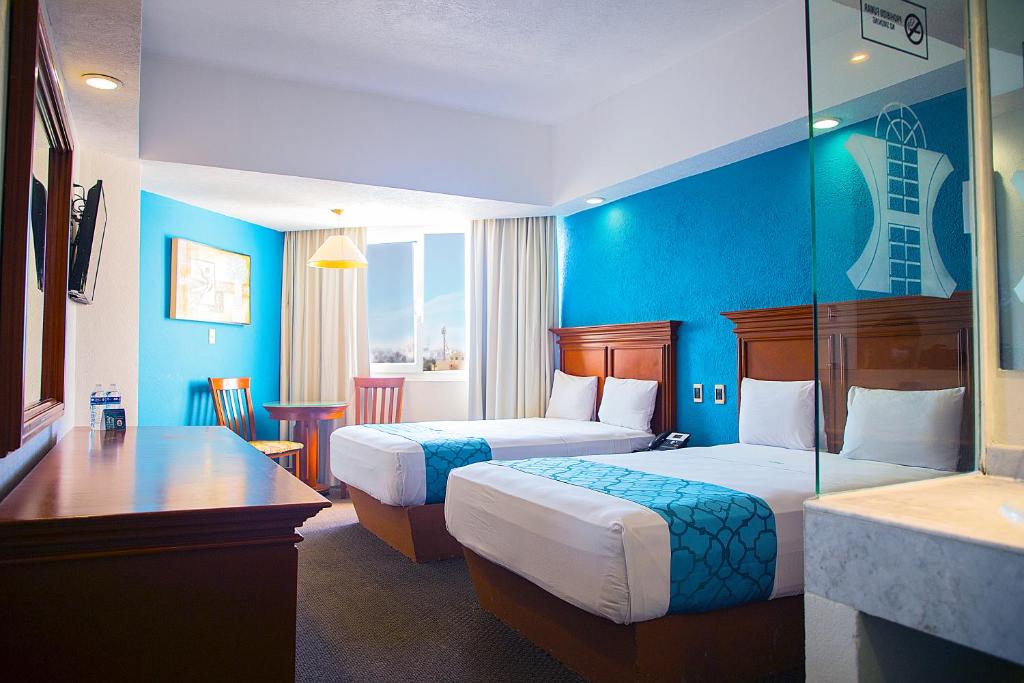 Postel nebo postele na pokoji v ubytování Hotel Lois Veracruz