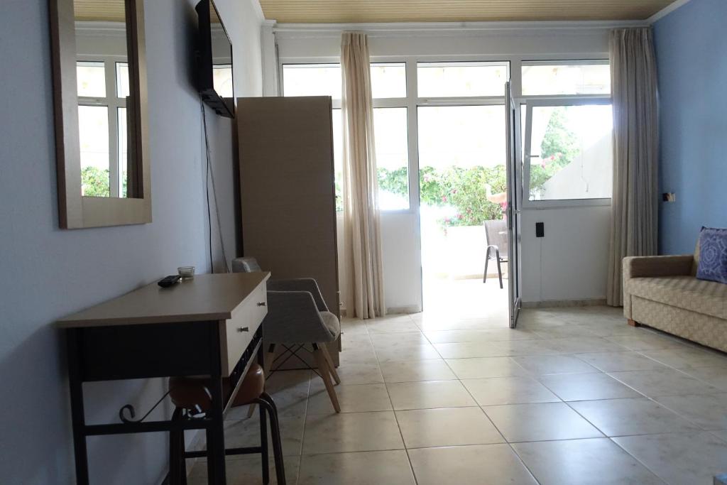 A television and/or entertainment centre at Ermioni Apartments