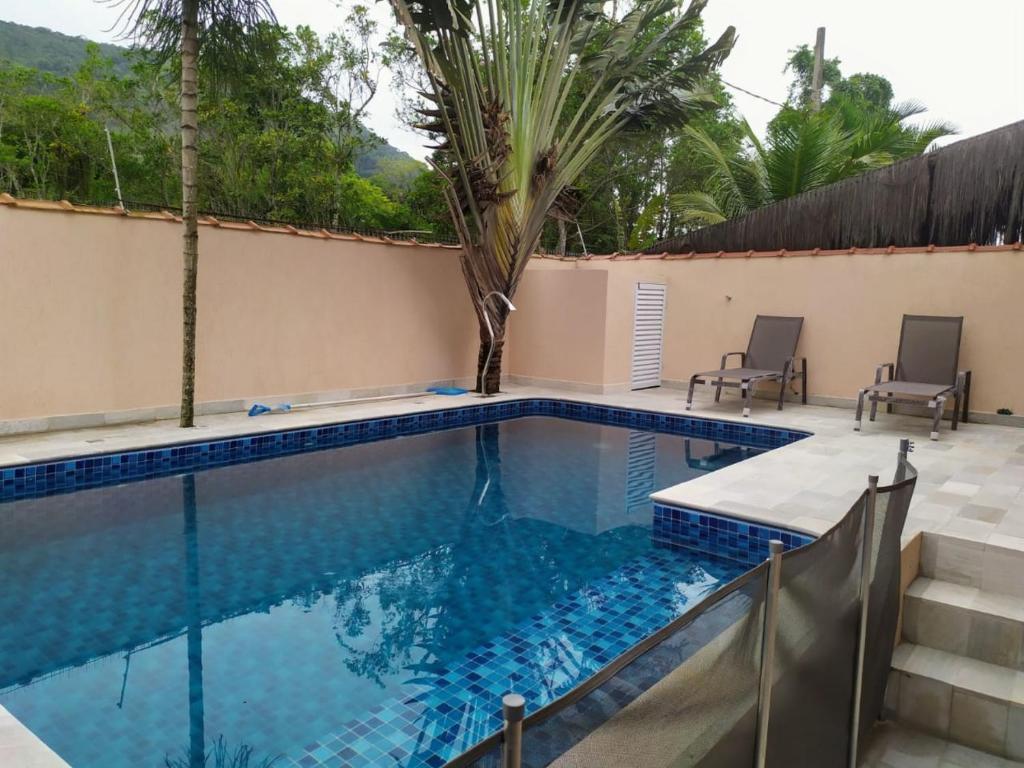  Casa em condomínio fechado em Camburizinho Litoral Norte com Piscina Privativa