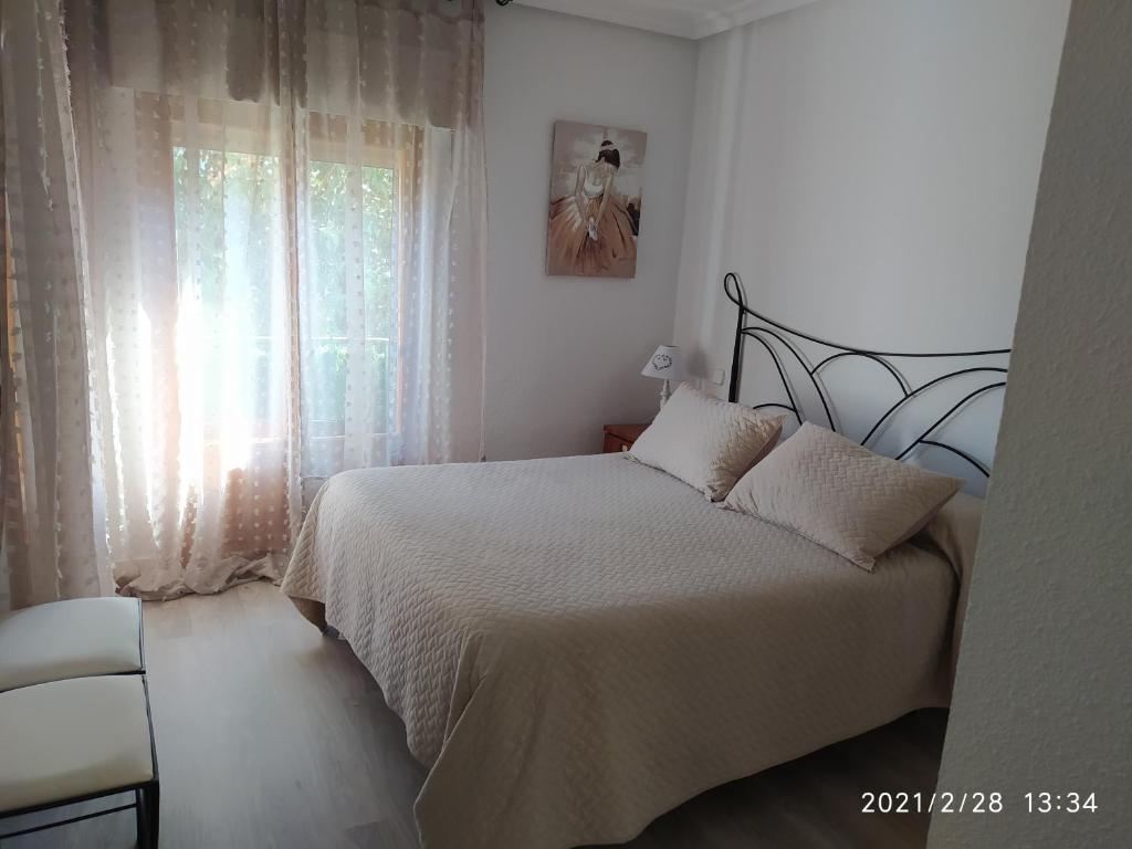 Postel nebo postele na pokoji v ubytování Apartamento Dacosta