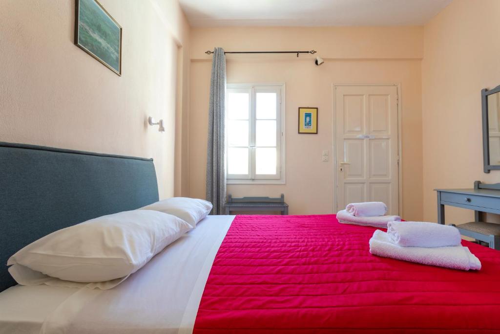 Postel nebo postele na pokoji v ubytování Vanas Apartments