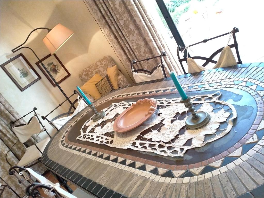 a glass table with a bowl on top of it at Villa Rossi in Polignano a Mare